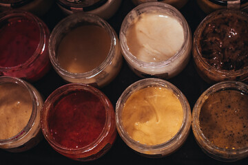 Glass jars with natural flower honey with different tastes. Organic and natural food