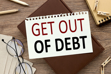 Get Out of Debt, notebook on a wooden table