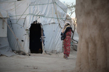 A Yemeni girl lives with her family in a camp for displaced people fleeing the hell of war in the...