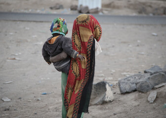  A Yemeni girl lives with her family in a camp for displaced people fleeing the hell of war in the...