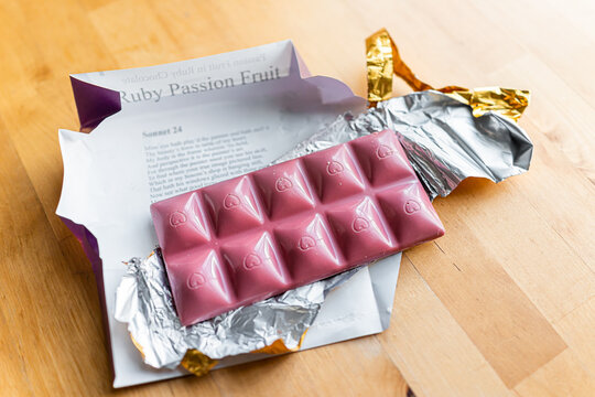 Herndon, USA - December 27, 2020: Closeup of open package of ruby passion fruit chocolate bar with sign label for famous brand Chocolove
