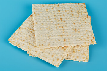 Matzah for the Jewish holiday of Passover on a blue background