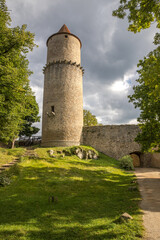 Fototapeta na wymiar round castle tower illuminated by the sun