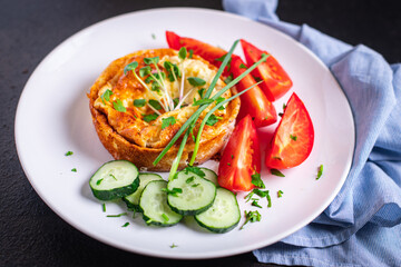 omelet with vegetables fresh breakfast fried eggs and tomato, cucumber fresh portion ready to eat meal snack on the table copy space food background rustic keto or paleo diet veggie 