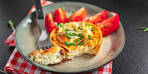omelet with vegetables fresh breakfast fried eggs and tomato, cucumber fresh portion ready to eat meal snack on the table copy space food background rustic keto or paleo diet veggie 