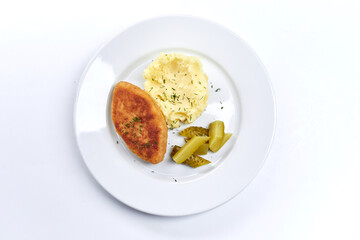 cutlet with mashed potato on white plate