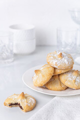 Chocolate filled shortbread cookies in a white kitchen