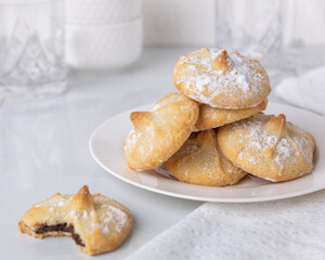 Chocolate filled shortbread cookies in a white kitchen