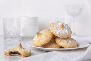 Chocolate filled shortbread cookies in a white kitchen