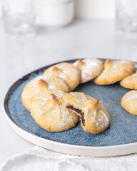 Chocolate filled shortbread cookies in a white kitchen
