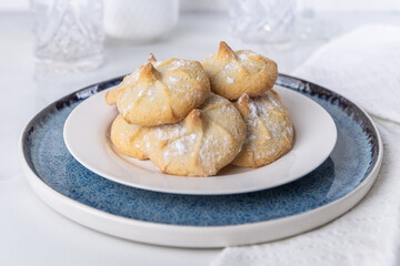 Chocolate filled shortbread cookies in a white kitchen