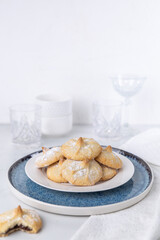 Chocolate filled shortbread cookies in a white kitchen