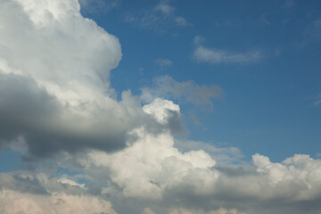 Naklejka na ściany i meble Cumulus clouds in the sky. Large white cloud.