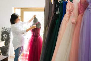 Young woman working as a seamstress