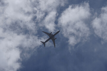 Passenger jet airliner flying high in the sky
