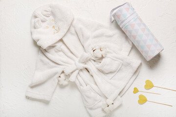 Stylish baby bathrobe on white background
