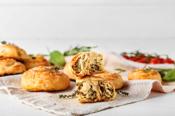 Puff pastry stuffed with spinach on table