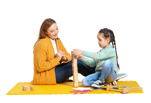 Female Psychologist Working With Girl Suffering From Autistic Disorder On White Background