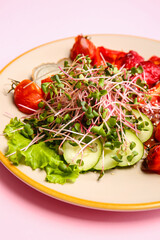 Plate of tasty salad with vegetables and micro green on color background, closeup