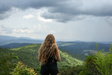 woman standing in the mountains
