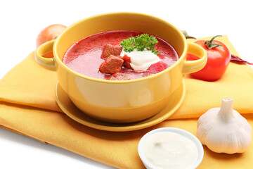 Pot of tasty borscht with sour cream on white background