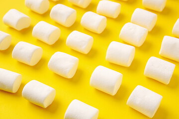 Tasty marshmallows on color background