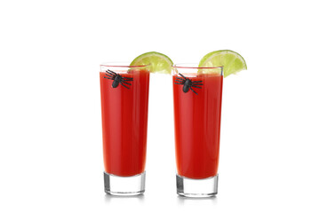 Shots of tasty bloody Mary cocktail with lime and decorated for Halloween on white background