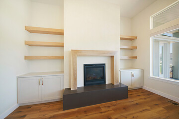 Modern conteporary fireplace interior with wood and windows