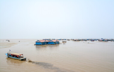 Fototapeta na wymiar Boat and Floating city on the Tonle Sap Lake, Cambodia