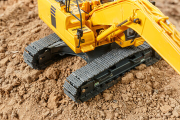 Selective focus ,Crawler excavator with  are digging the soil in the construction site .