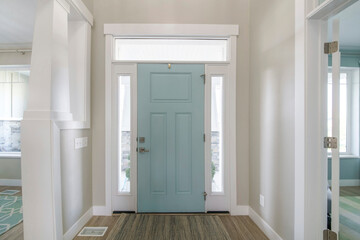 Mint front door interior with transom window and sidelights - obrazy, fototapety, plakaty