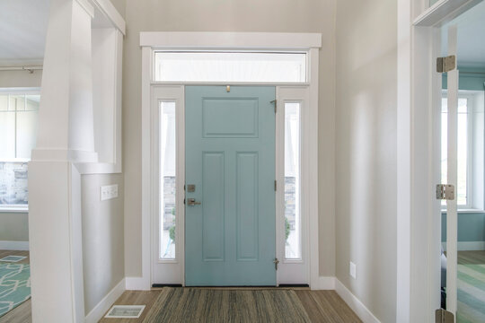 Mint front door interior with transom window and sidelights