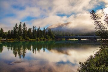 Cloudy Sky Over Banff Mountains And River 