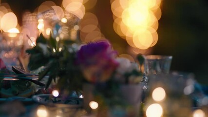 close up romantic dinner table decorated with roses for evening celebration fine dining by candle lights celebrating valentines day anniversary concept 4k