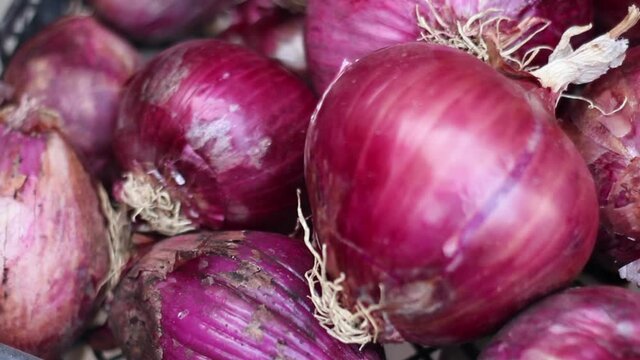 Fresh red onions on a market with a nice depth of field