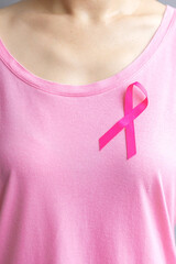 October Breast Cancer Awareness month, elderly Woman in pink T- shirt with Pink Ribbon for...