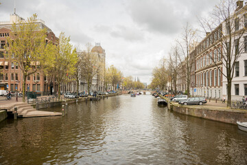 Naklejka premium Amsterdam Canal Lined With Historic Buildings 