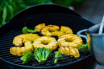Grilled pineapple slices ready to eat.