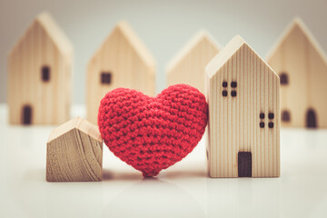 Love heart between big and small house model for stay at home love together and healthy community concept. - Powered by Adobe