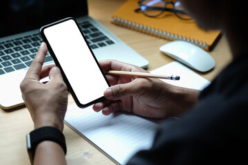 Close up view man holding smart phone with empty display.