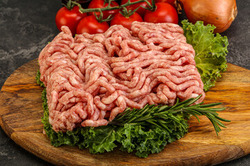 Raw pork minced meat over board