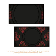 Black business card design with red Maori mask ornaments.