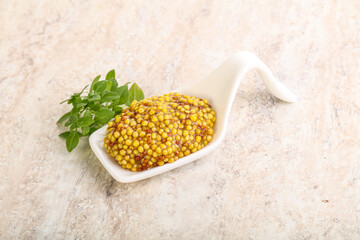 Grain mustard sauce in the bowl