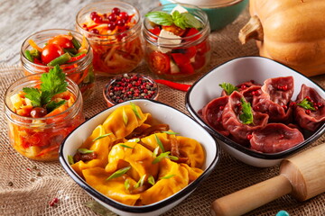 yellow and red dumplings, dumplings on a wooden board