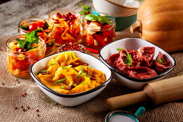 yellow and red dumplings, dumplings on a wooden board