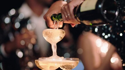 happy celebration woman pouring champagne tower at glamorous dance party celebrating with friends enjoying crazy nightlife wearing stylish fashion dancing on rooftop at night 4k footage