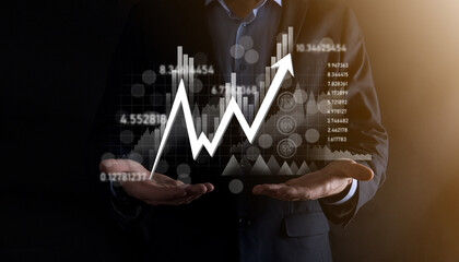 Hand hold sales data and economic growth graph chart. Business planning and strategy. Analysing trading of exchange. Financial and banking. Technology digital marketing.Profit and growing plan.