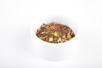 tea leaves for brewing in a white cup