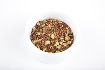 tea leaves for brewing in a white cup