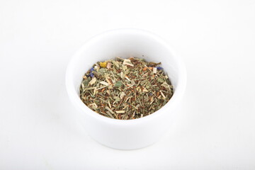 Fototapeta na wymiar tea leaves for brewing in a white cup